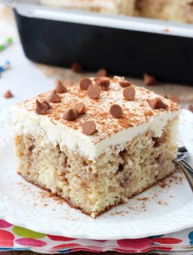 A Piece of Cinnamon Roll Poke Cake on a Plate