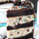Funfetti Cake Batter Cookie Dough Brownie Layer Cake slice on white plate