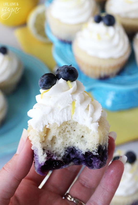 Lemon Blueberry Cupcake in a hand with a bite out of it