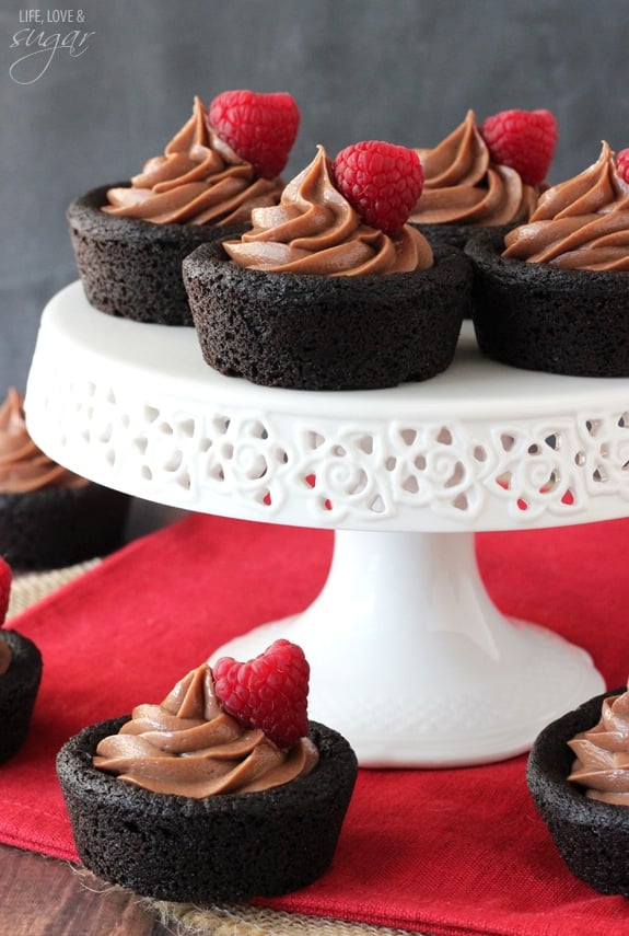 Nutella Cheesecake Chocolate Cookie Cups on a white cake stand