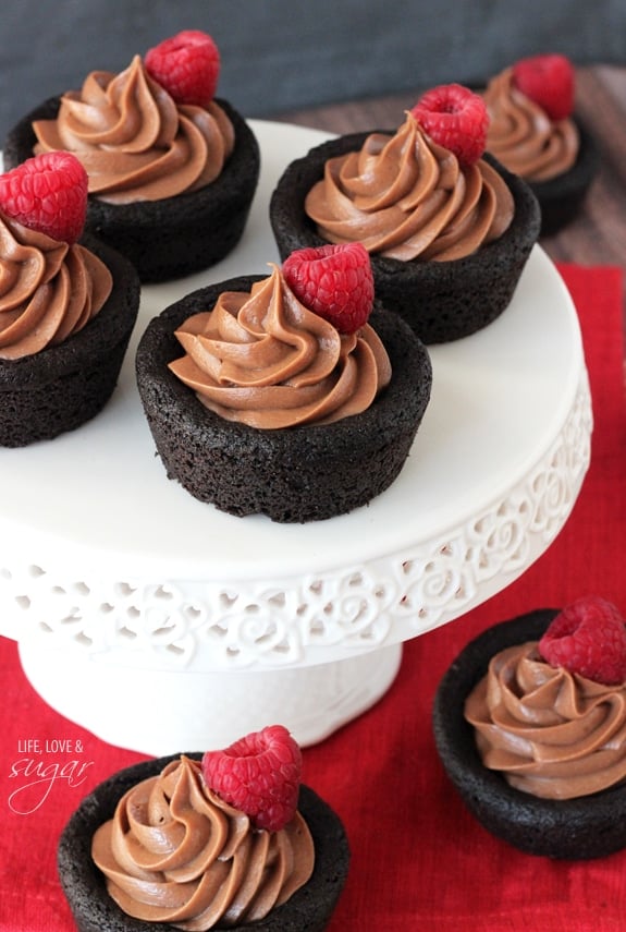 Nutella Cheesecake Chocolate Cookie Cups on a white cake stand