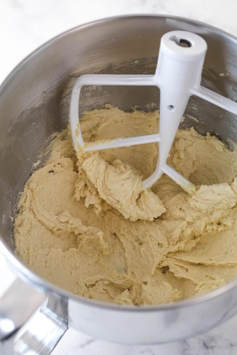 butter and sugars combined and creamed in silver mixing bowl