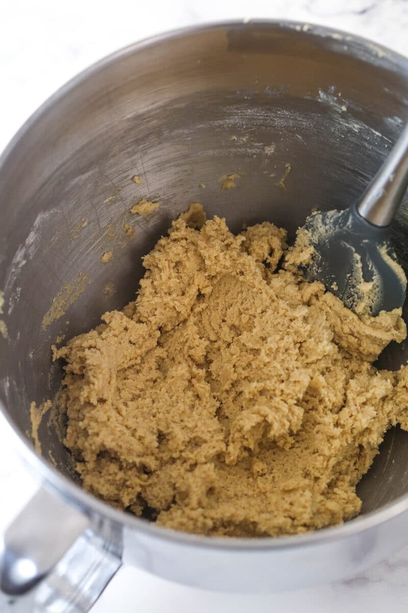 fully made cookie dough combined in silver mixing bowl