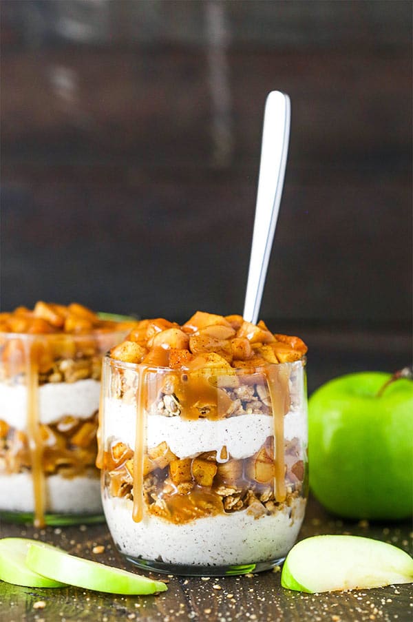 a jar of caramel apple trifle with a spoon in it