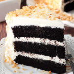 Chocolate Coconut Cake slice on white plate