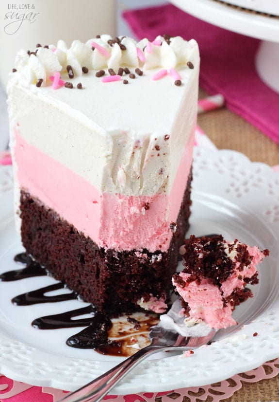 Neapolitan Ice Cream Cake slice on a plate with a bite on a fork