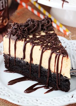Pumpkin Chocolate Brownie Cheesecake slice on white plate