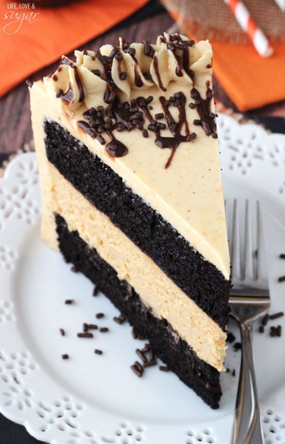 Overhead view of a slice of Pumpkin Chocolate Cheesecake Cake on a plate
