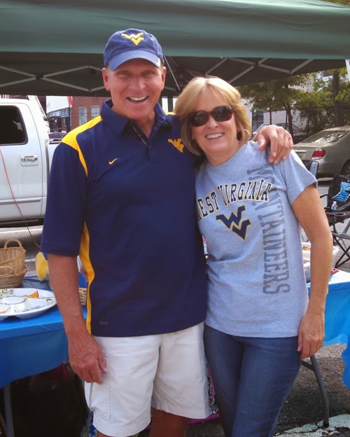 Lindsay's Parents Smiling with their Arms Around Each Other at the Tailgate