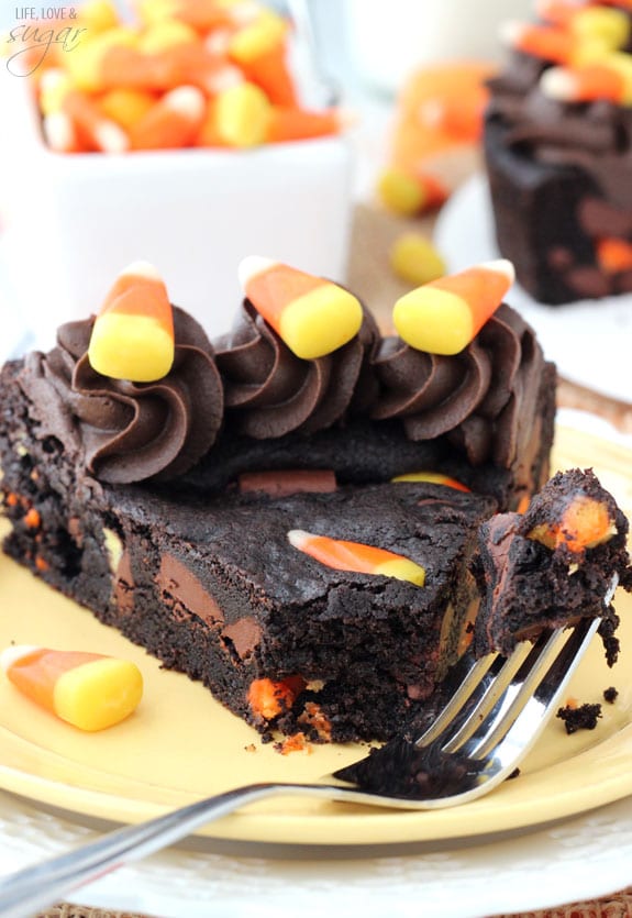 Candy Corn Chocolate Chip Cookie Cake slice on a plate with a bite on a fork