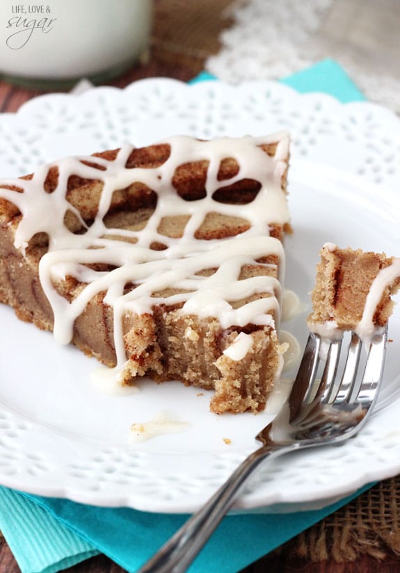 A Slice of Cinnamon Roll Cookie Cake with a Bite on a Fork