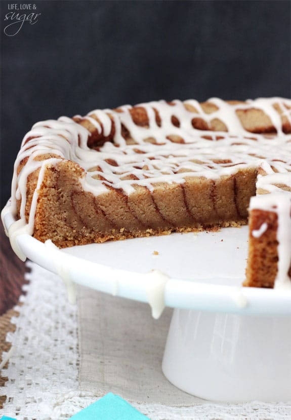 A Giant Cinnamon Roll Cookie Cake on a Cake Platter