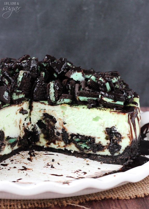 Mint Oreo Cheesecake on a plate with a couple slices removed