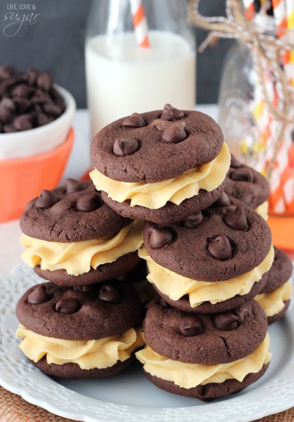 A Stack of Pumpkin Chocolate Chip Cookie Sandwiches on a plate