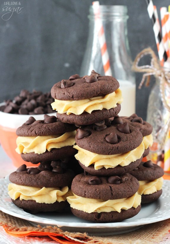 Pumpkin Chocolate Chip Cookie Sandwiches Stacked on a Plate