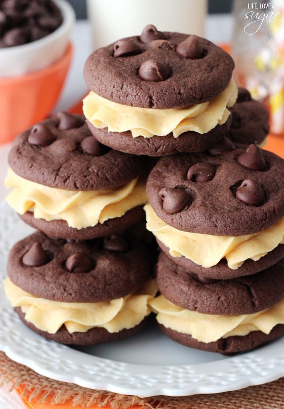 A Stack of Pumpkin Chocolate Chip Cookie Sandwiches on a Plate