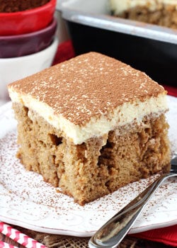 Tiramisu Poke Cake on white plate