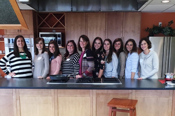 a group of ladies in a kitchen