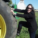 Lindsay with John Deere tractor