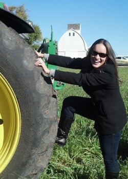 Lindsay with John Deere tractor