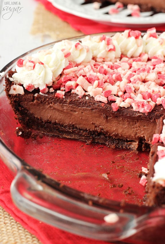 Brownie Brittle Peppermint Chocolate Pie in a pie plate with a couple slices removed