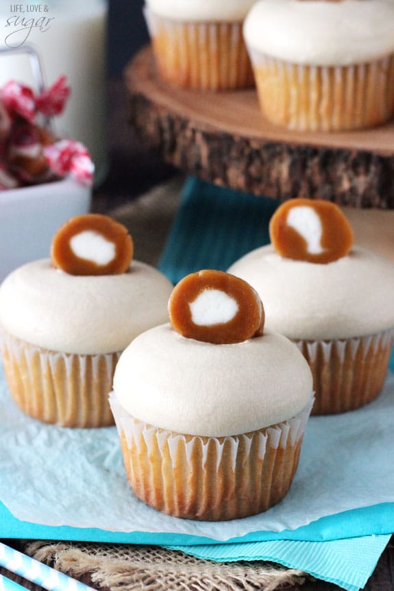 Caramel Cream Cupcakes on blue and white paper