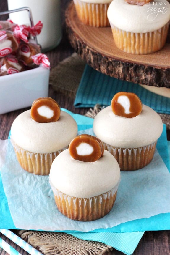 Caramel Cream Cupcakes on blue and white paper