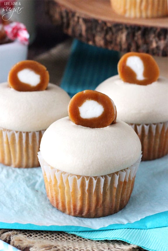 Caramel Cream Cupcakes on blue and white paper