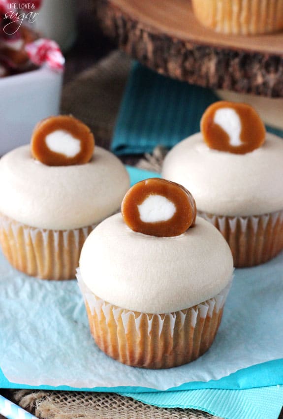 Caramel Cream Cupcakes on blue and white paper