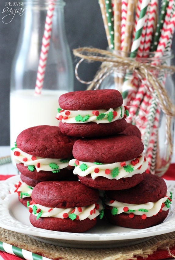 Red Velvet Cookie Sandwiches stacked on a plate