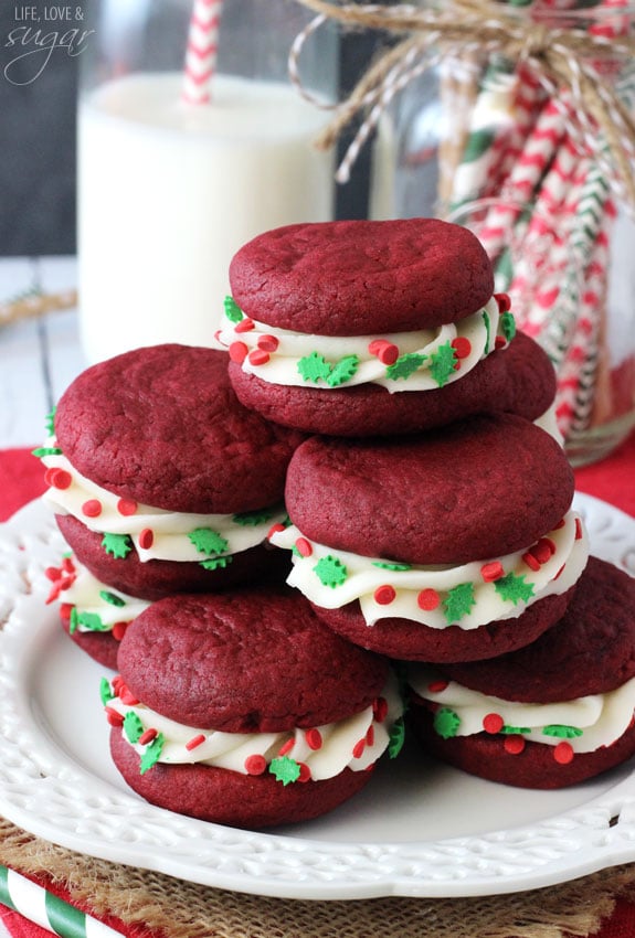 Red Velvet Cookie Sandwiches stacked on a plate