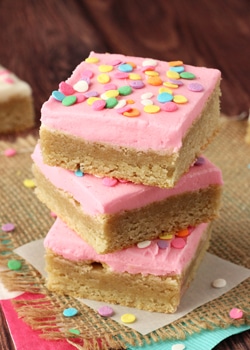 Frosted Sugar Cookie Bars pink frosting stacked