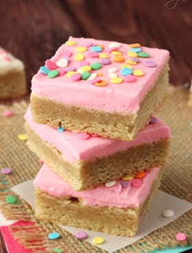 Frosted Sugar Cookie Bars pink frosting stacked
