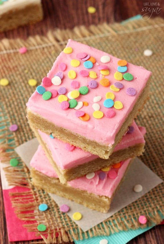 Pink Frosted Sugar Cookie Bars in a stack