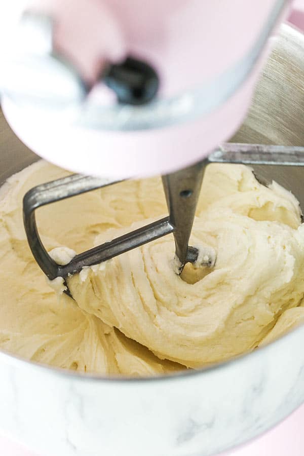 A stand mixer with frosting inside