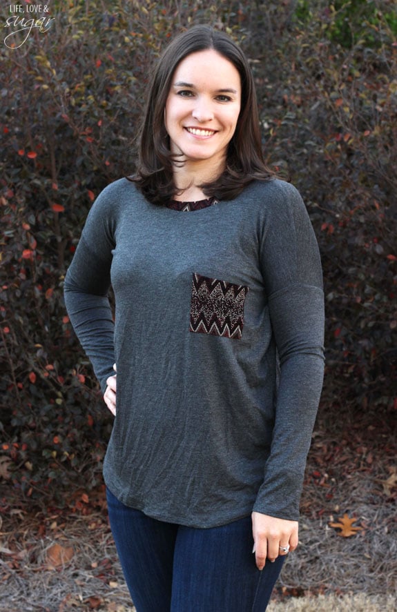 Author posing in a gray shirt