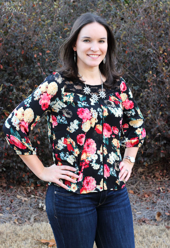 Author posing in a floral top