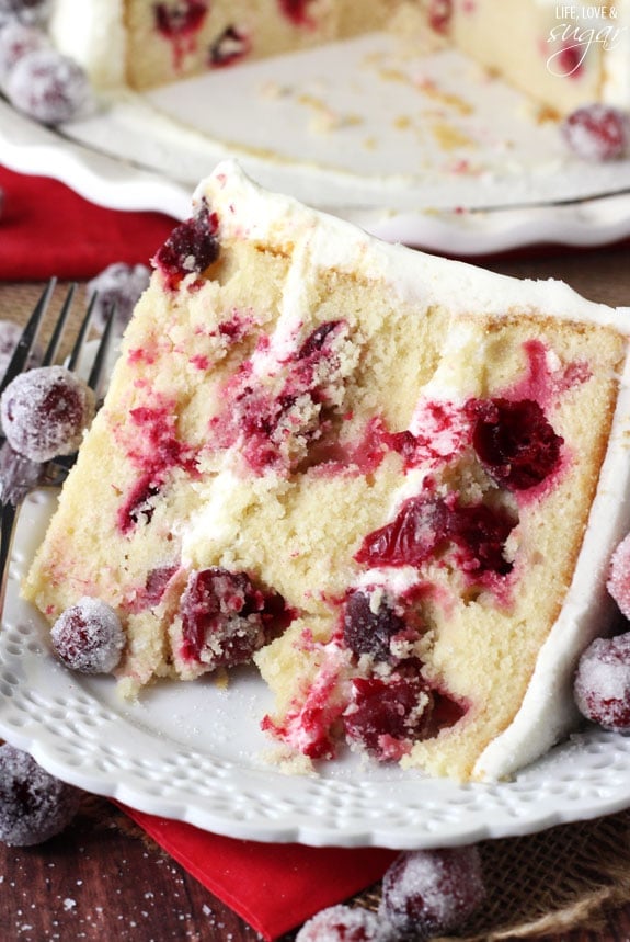 Sparkling Cranberry White Chocolate Cake slice on a plate