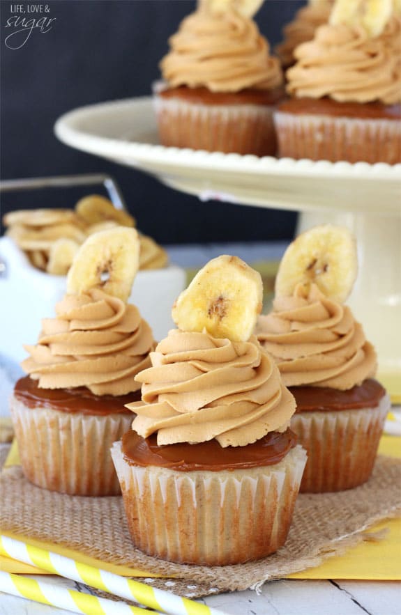 Banoffee Cupcakes - moist banana cupcake, with a layer of dulce de leche, finished off with dulde leche icing and a banana chip!