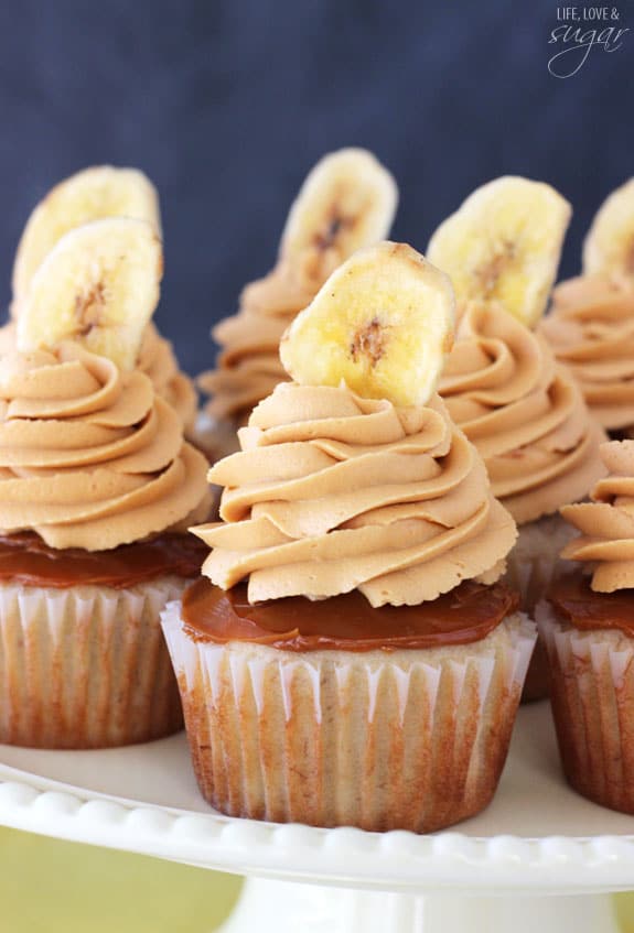 Banoffee Cupcakes - moist banana cupcake, with a layer of dulce de leche, finished off with dulde leche icing and a banana chip!