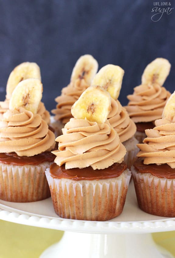 Banoffee Cupcakes - moist banana cupcake, with a layer of dulce de leche, finished off with dulde leche icing and a banana chip!