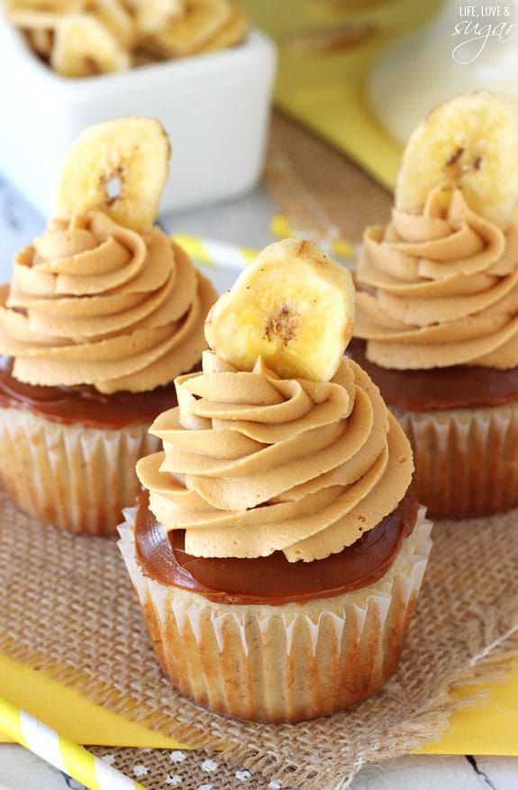 Banoffee Cupcakes - moist banana cupcake, with a layer of dulce de leche, finished off with dulde leche icing and a banana chip!