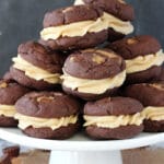 Reese's Peanut Butter Chocolate Cookie Sandwiches on white stand