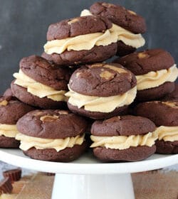 Reese's Peanut Butter Chocolate Cookie Sandwiches on white stand