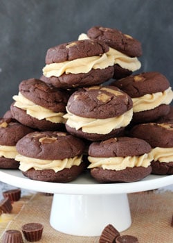 Reese's Peanut Butter Chocolate Cookie Sandwiches on white stand
