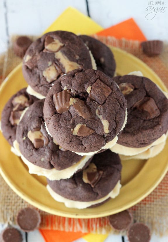 Top view of Reese's Peanut Butter Chocolate Cookie Sandwiches stacked on a yellow plate