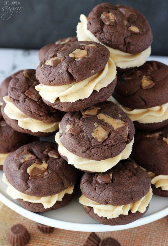 Reese's Peanut Butter Chocolate Cookie Sandwiches stacked on white stand