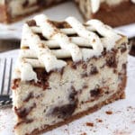 Cinnamon Roll Cheesecake slice on white plate