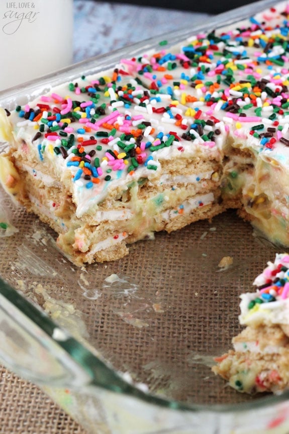 Funfetti Birthday Cake Icebox Cake in a 9x13 pan with several slices removed