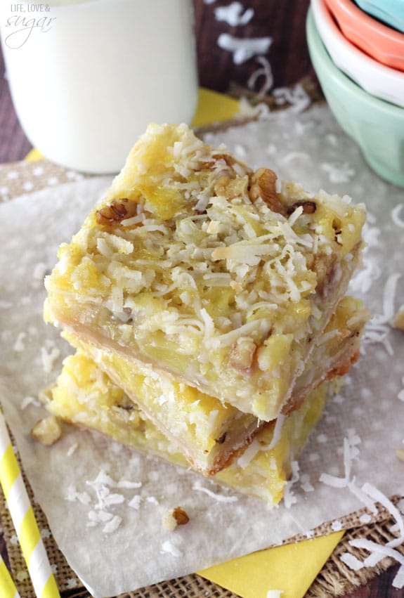 Pineapple Coconut Bars stacked on a napkin